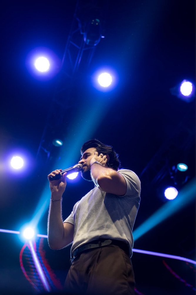 Live music performance under stage lighting by Ninth Frame Media, image 6