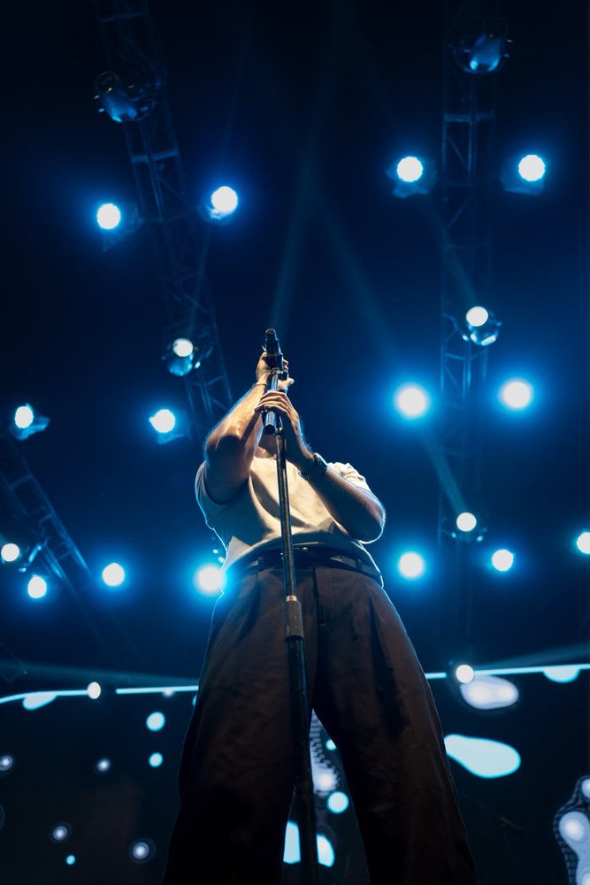 Live music performance under stage lighting by Ninth Frame Media, image 7